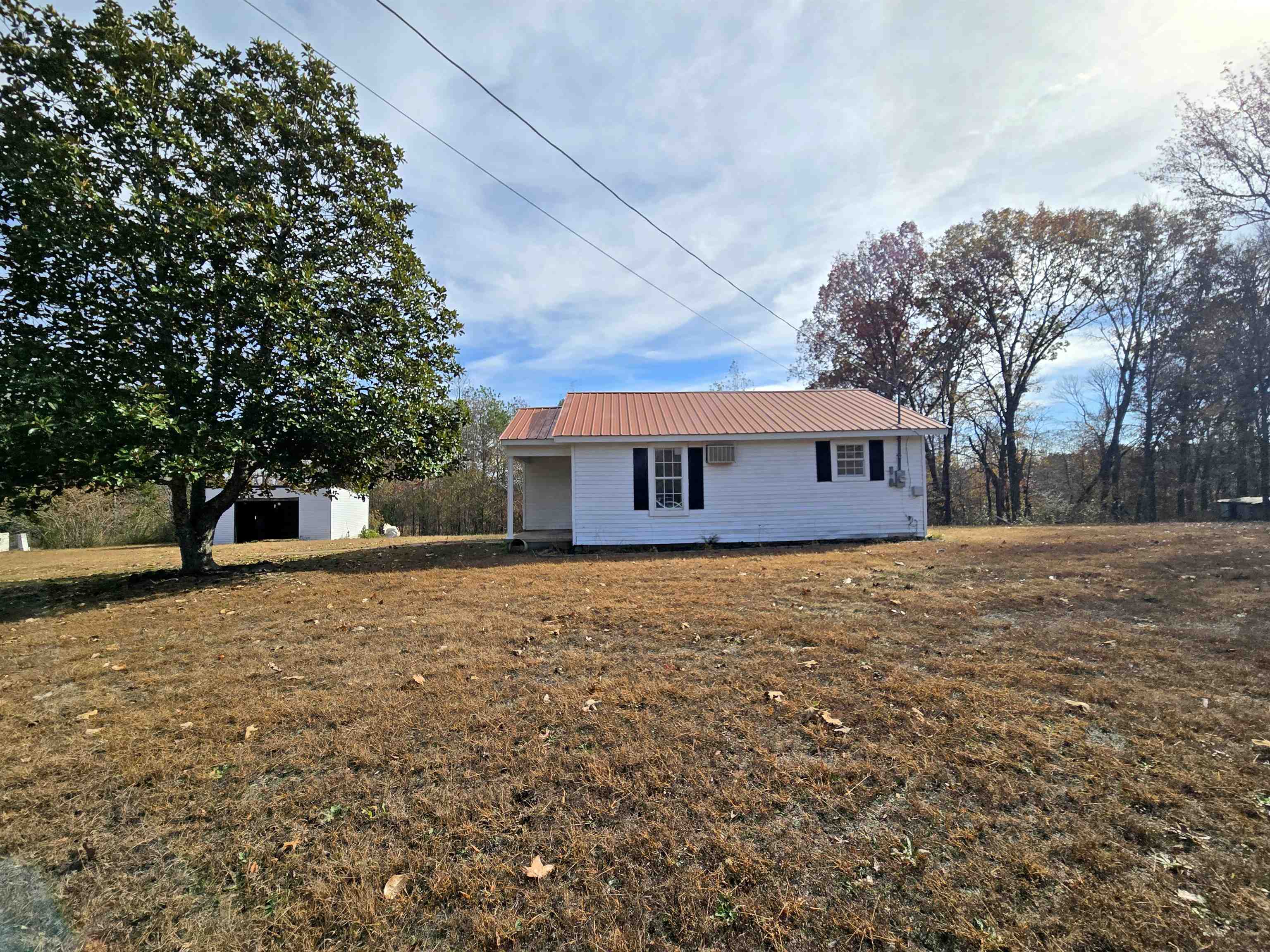 1907 Elmer Cox Road Bethel Springs, TN 38315 - Photo 11 of 17 a front view of a house with a yard