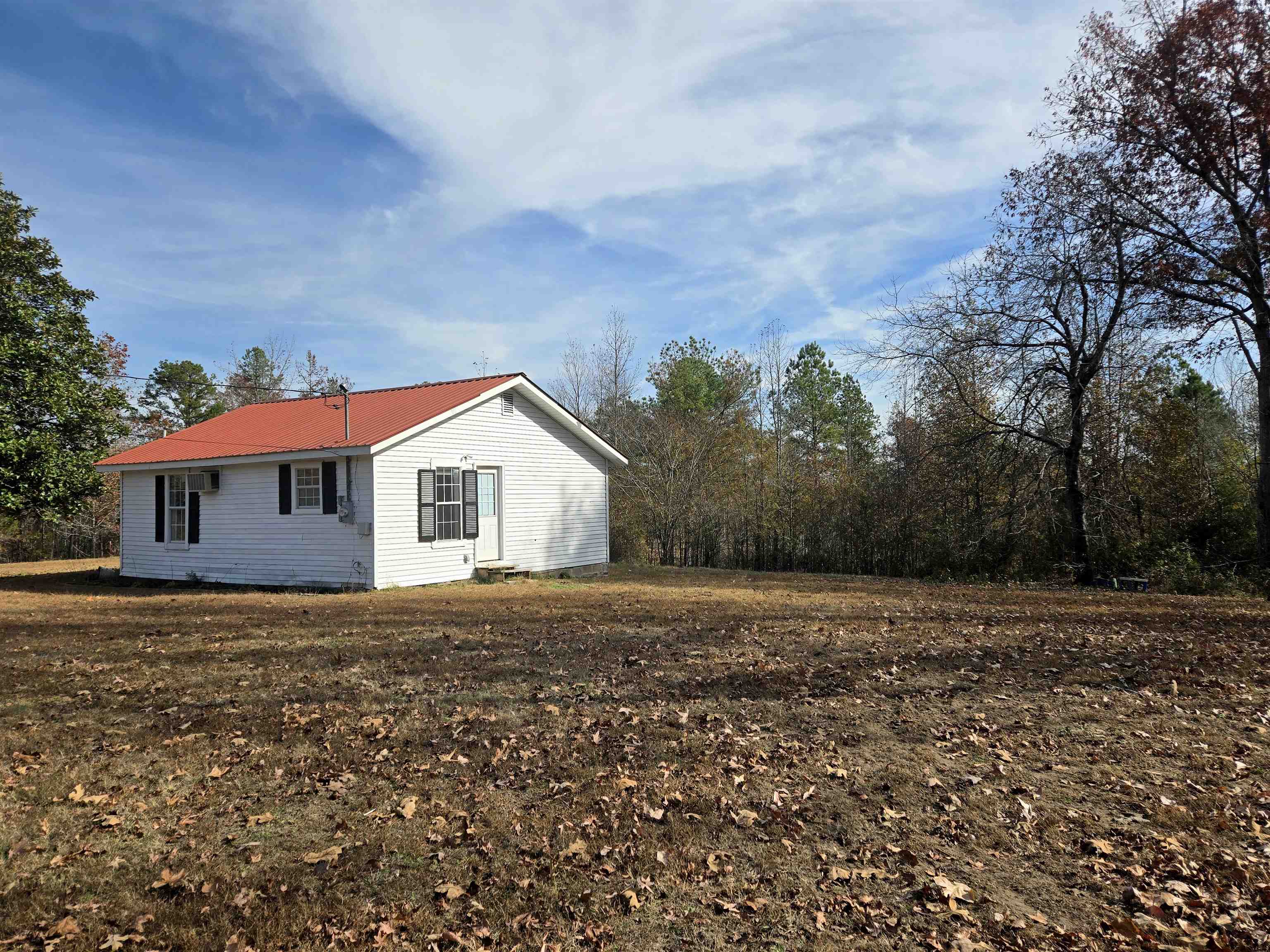 1907 Elmer Cox Road Bethel Springs, TN 38315 - Photo 12 of 17 a house with yard in front of it
