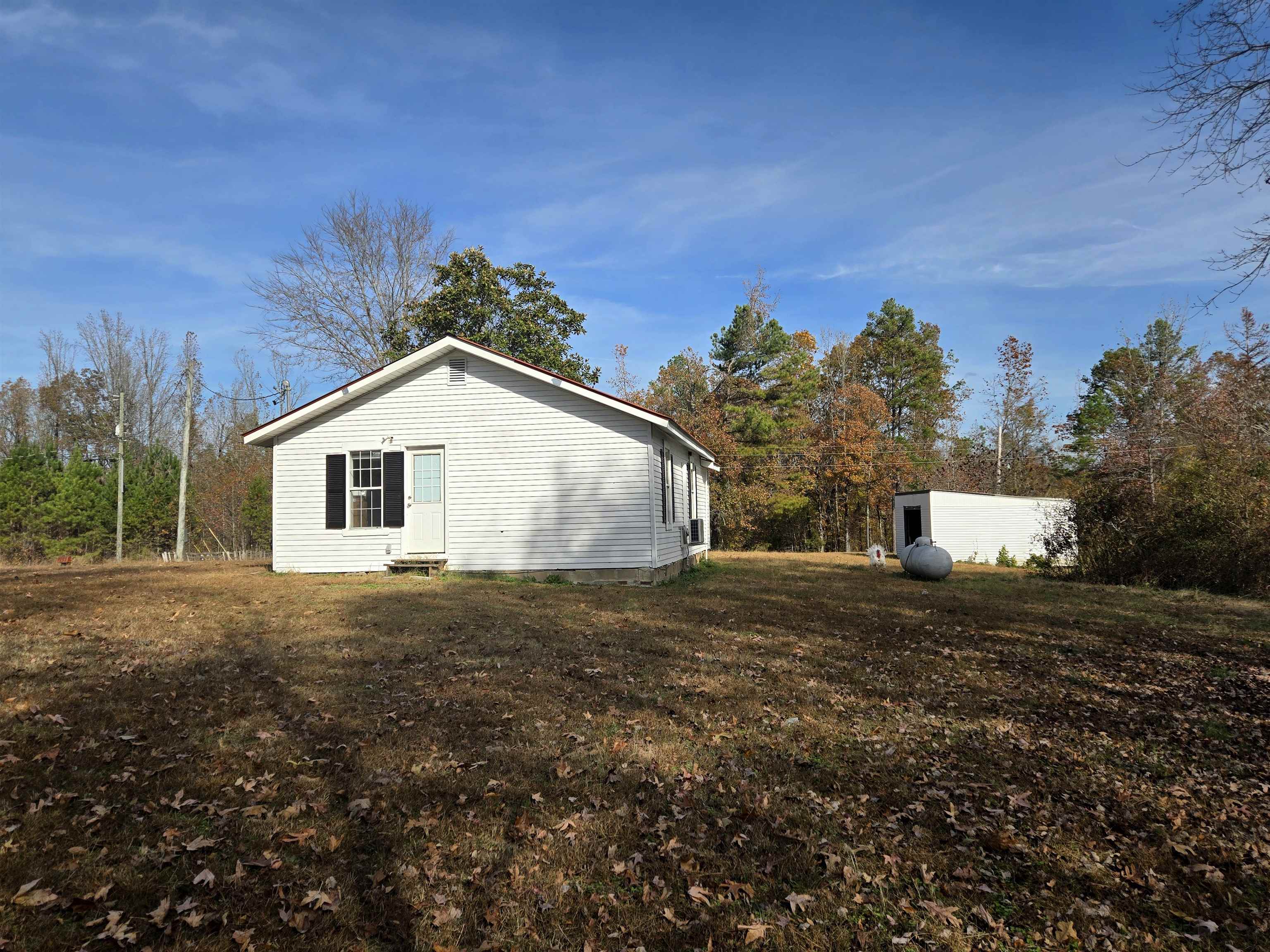 1907 Elmer Cox Road Bethel Springs, TN 38315 - Photo 13 of 17 a view of a house with a yard