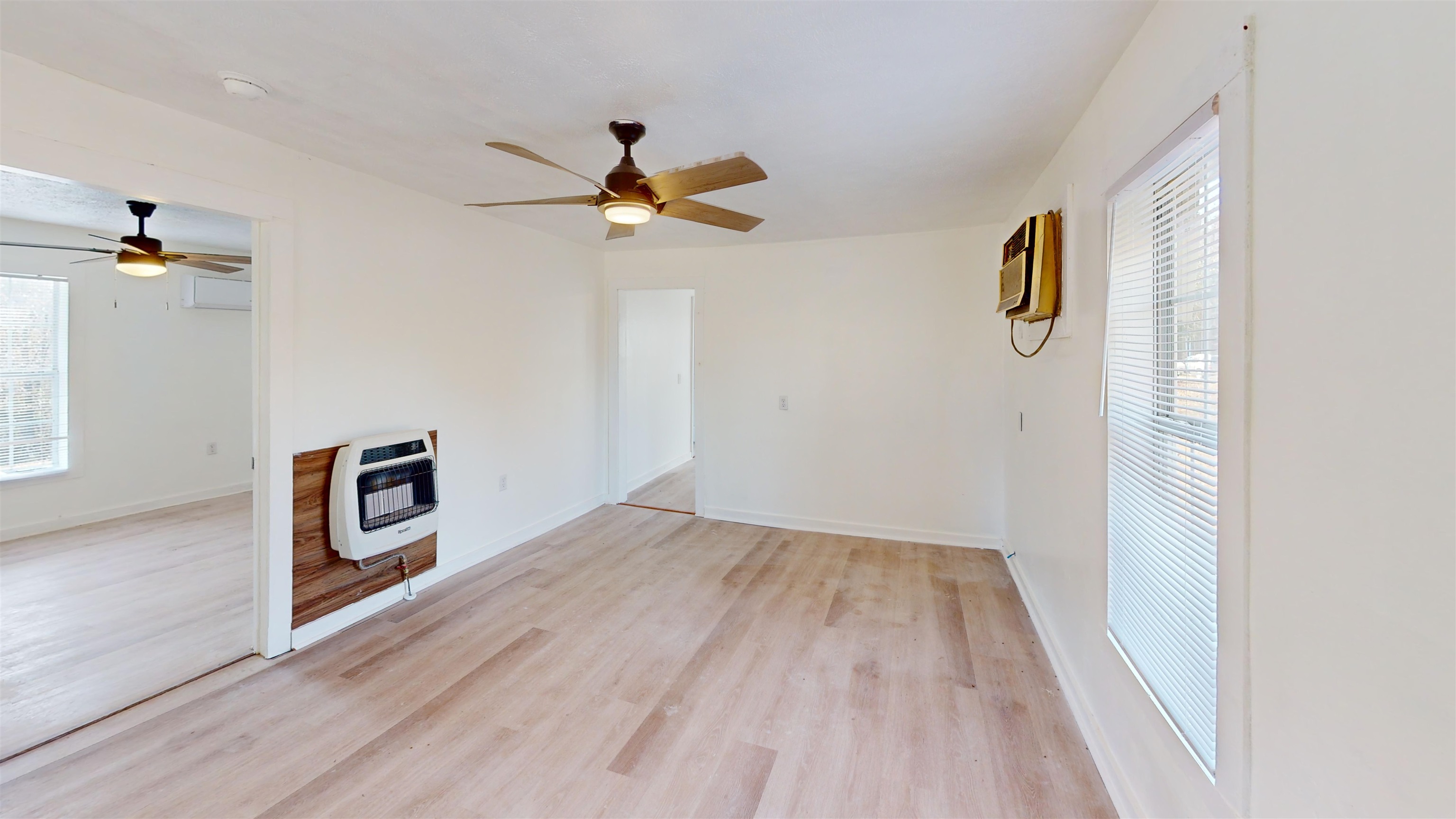 1907 Elmer Cox Road Bethel Springs, TN 38315 - Photo 3 of 17 a view of an empty room with a window