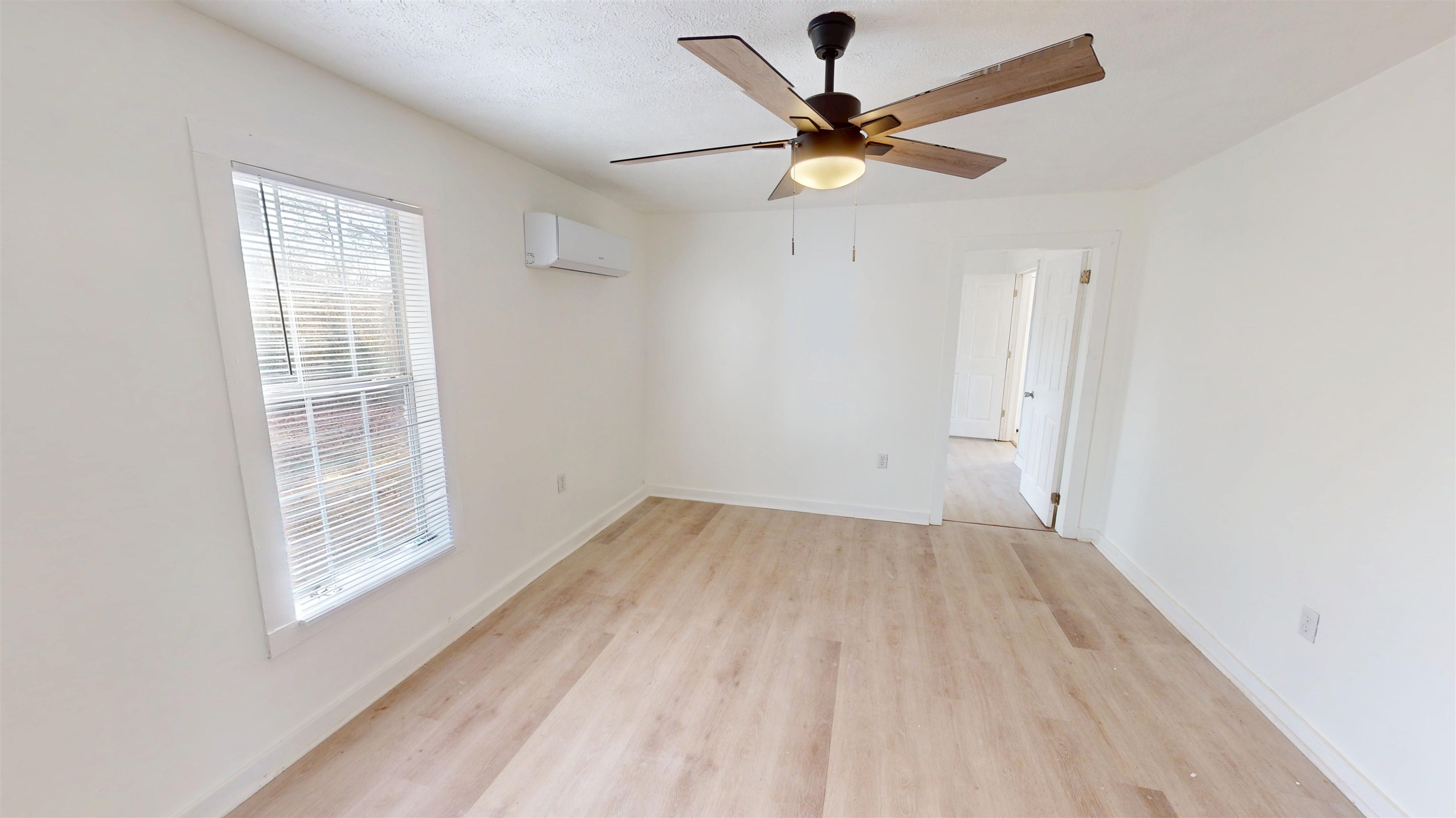 1907 Elmer Cox Road Bethel Springs, TN 38315 - Photo 6 of 17 wooden floor in an empty room with a window