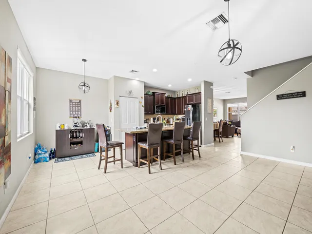 a room with lots of chairs and mirrors