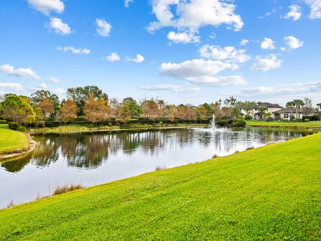 an aerial view of residential building and lake