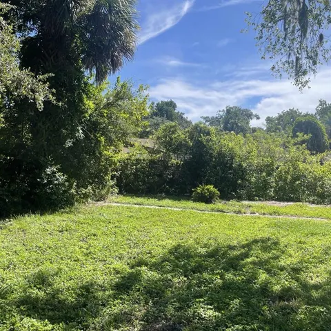 a view of outdoor space with deck and yard