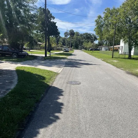 a view of a park with swings and slides