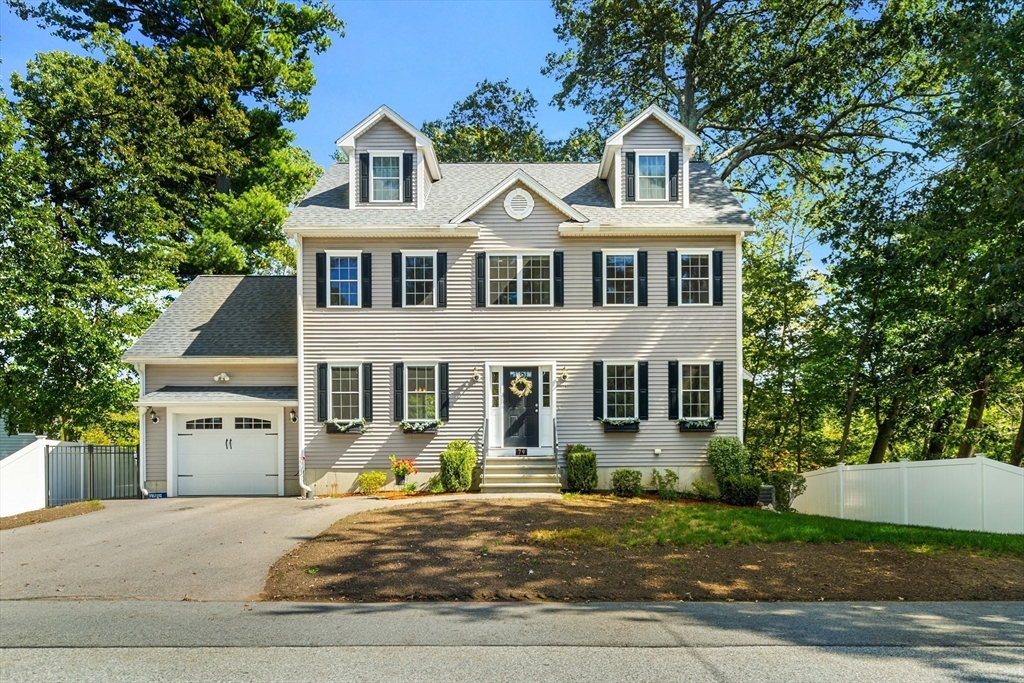 79 Bridle Road Billerica, MA 01821 - Photo 2 of 42 front view of a house with a yard