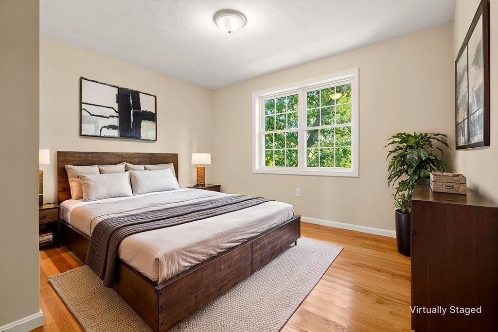 79 Bridle Road Billerica, MA 01821 - Photo 21 of 42 a bedroom with bed and a potted plant