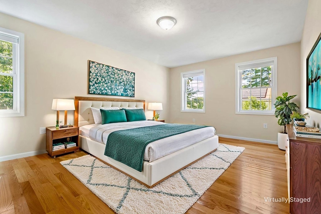 79 Bridle Road Billerica, MA 01821 - Photo 25 of 42 a bedroom with a large bed a rug and a window