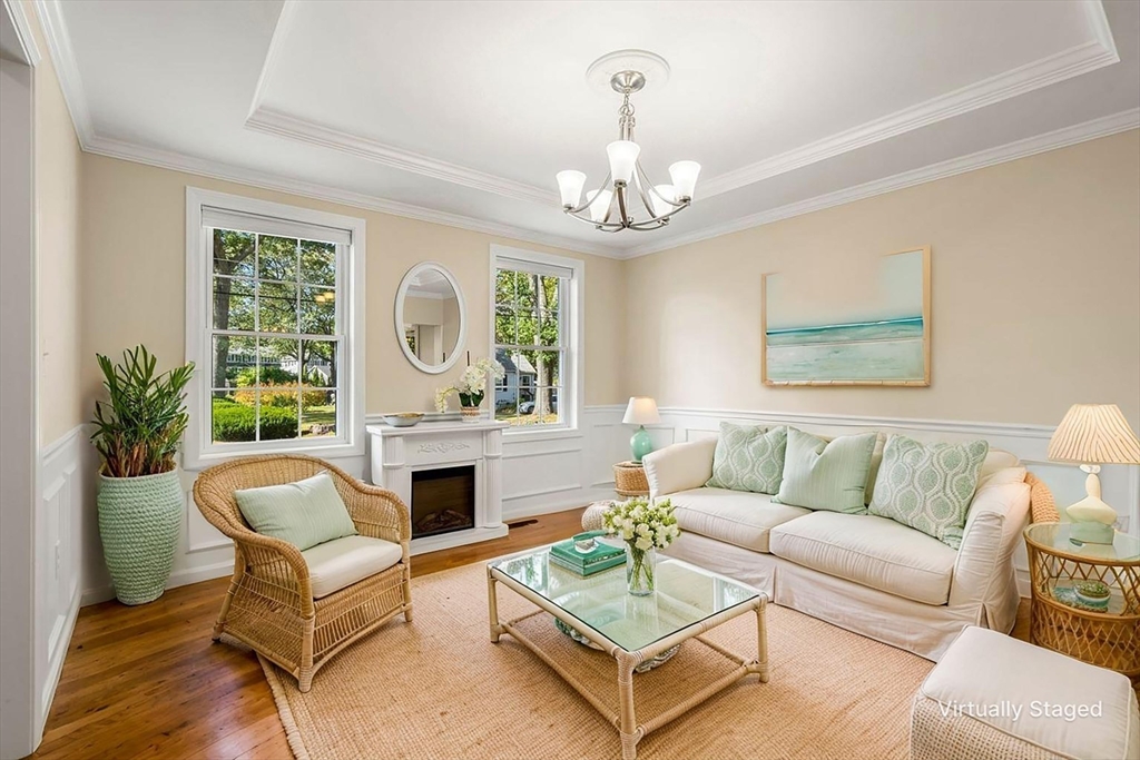 79 Bridle Road Billerica, MA 01821 - Photo 8 of 42 a living room with furniture chandelier and a fireplace