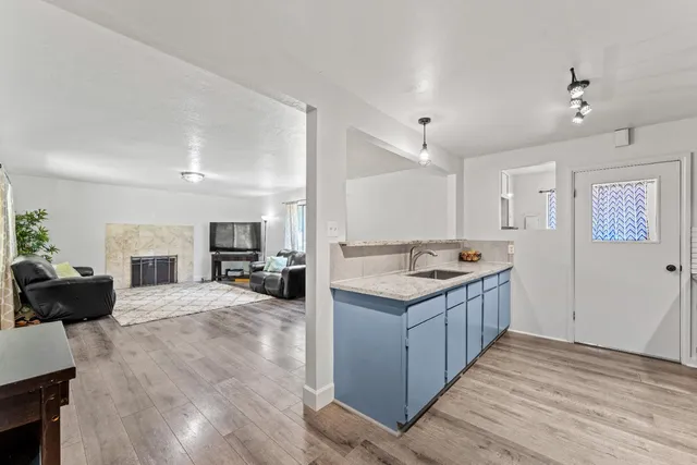 a view of a kitchen counter top space and wooden floor
