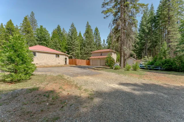 a house with trees in the background