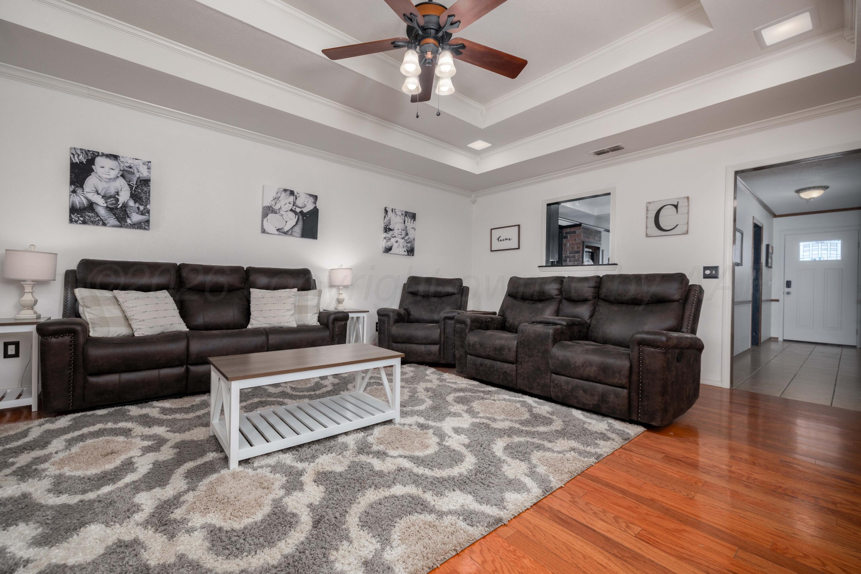 6801 Rochelle Lane Amarillo, TX 79109 - Photo 12 of 40 a living room with furniture and a wooden floor