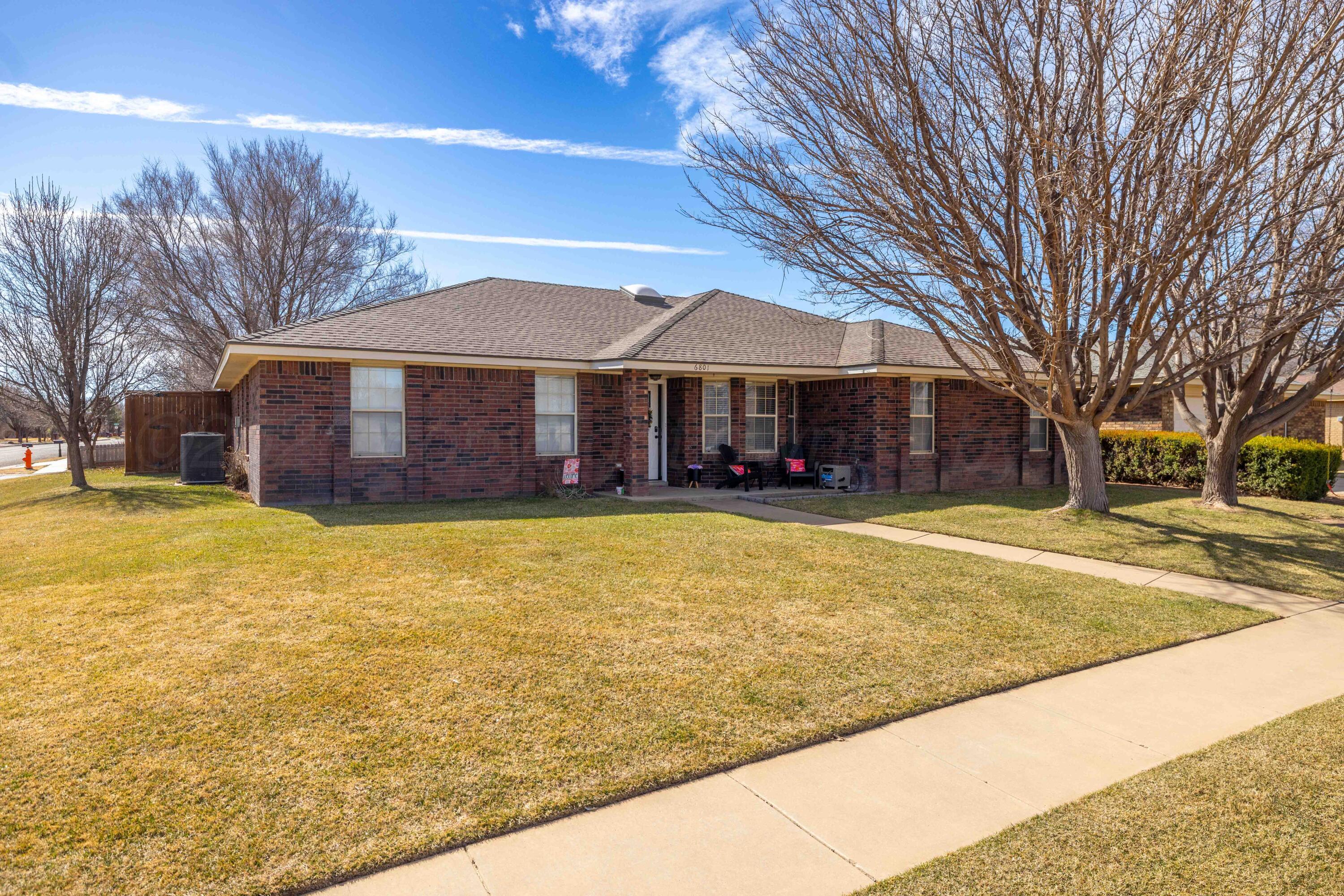 6801 Rochelle Lane Amarillo, TX 79109 - Photo 3 of 40 a front view of building with large trees