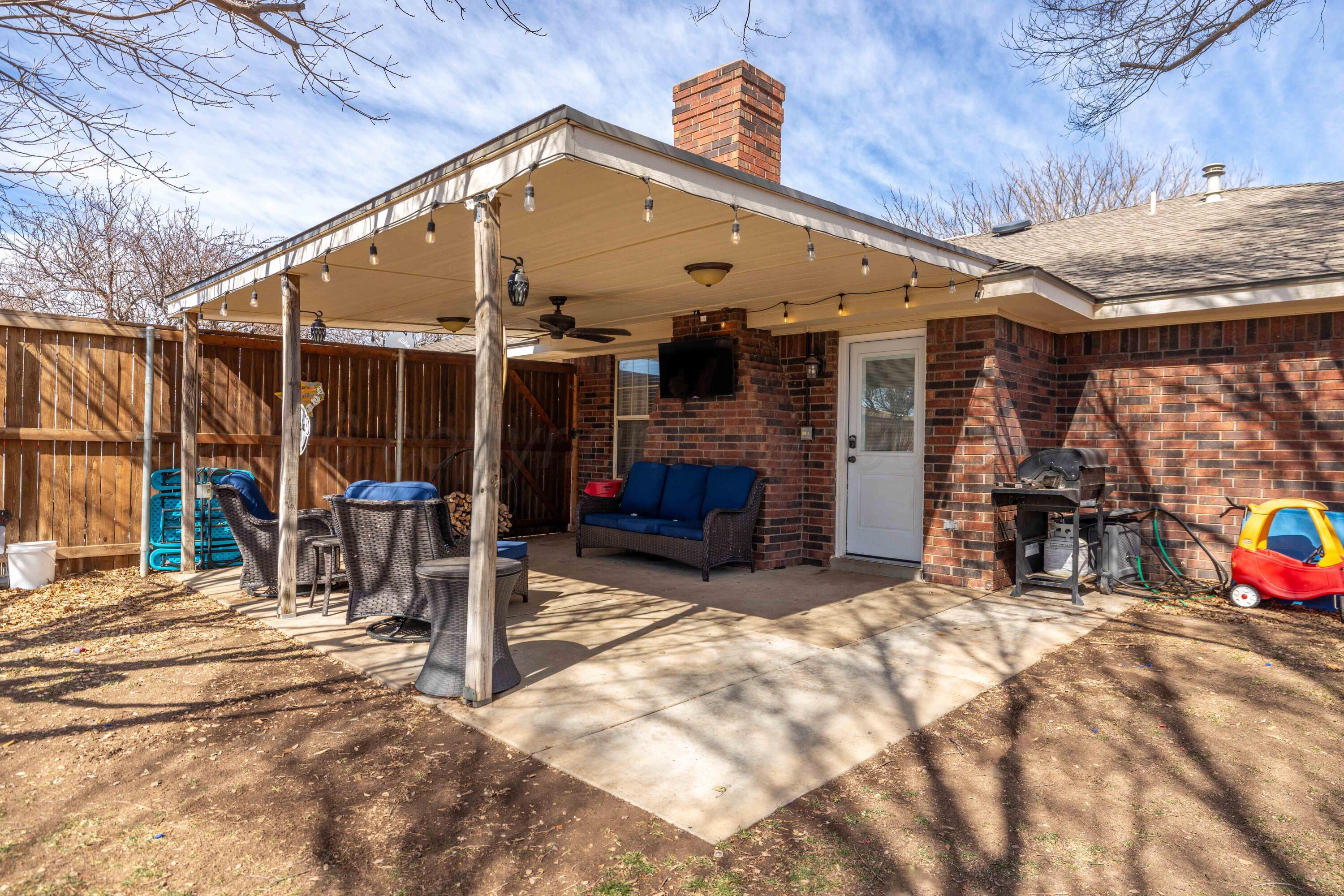 6801 Rochelle Lane Amarillo, TX 79109 - Photo 34 of 40 a view of a house with patio area and a patio