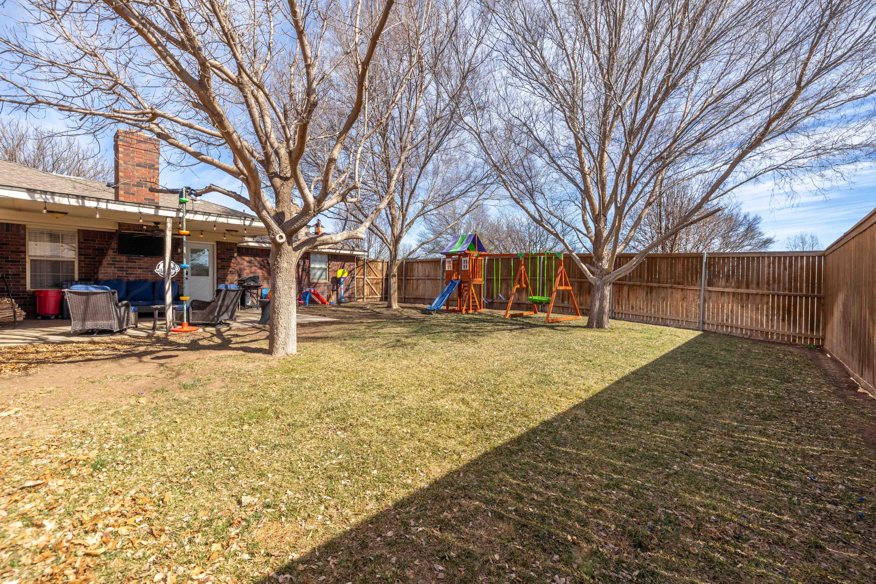 6801 Rochelle Lane Amarillo, TX 79109 - Photo 39 of 40 a view of street with trees and covered with snow