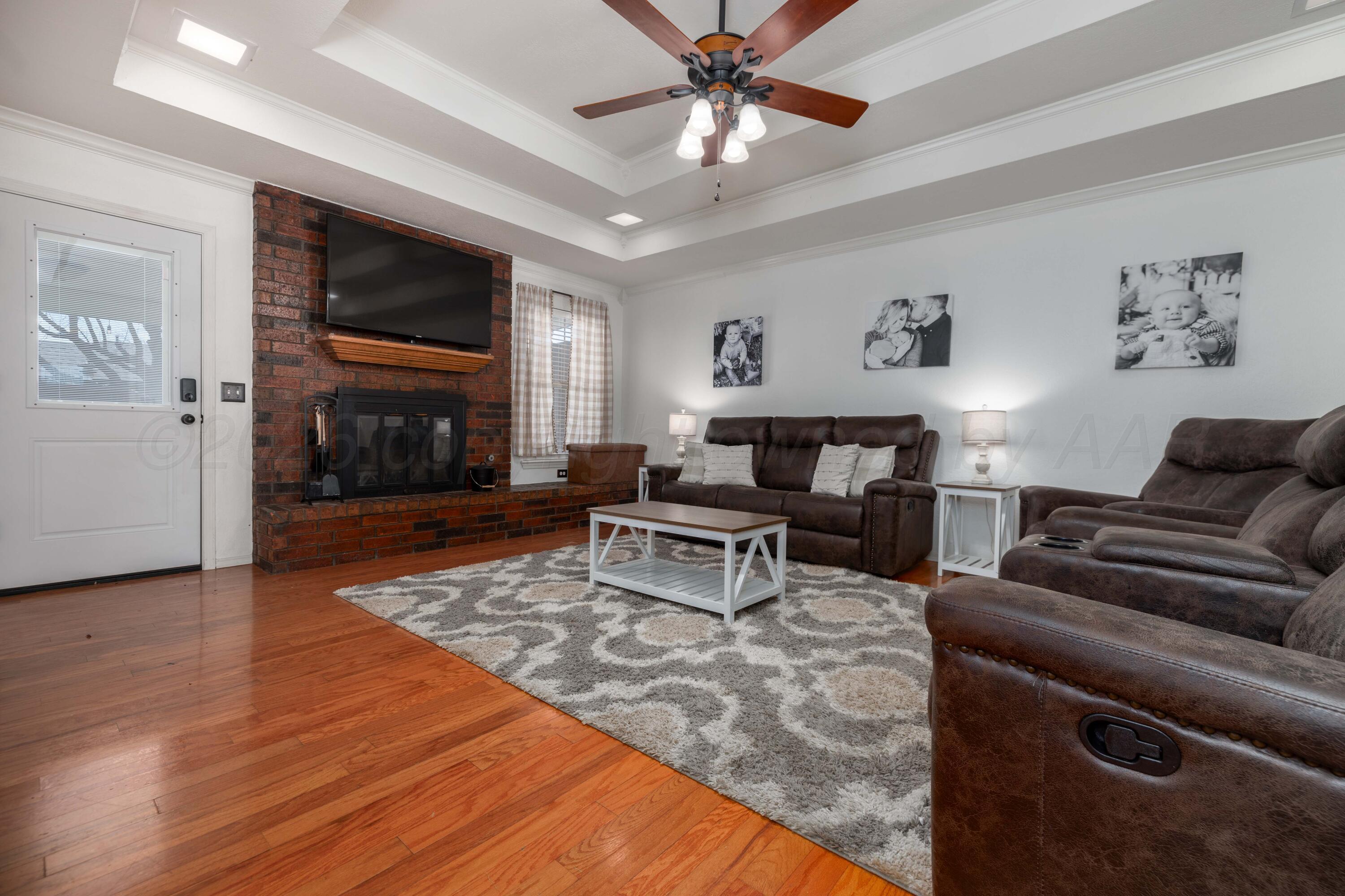 6801 Rochelle Lane Amarillo, TX 79109 - Photo 10 of 40 a living room with furniture and a fireplace