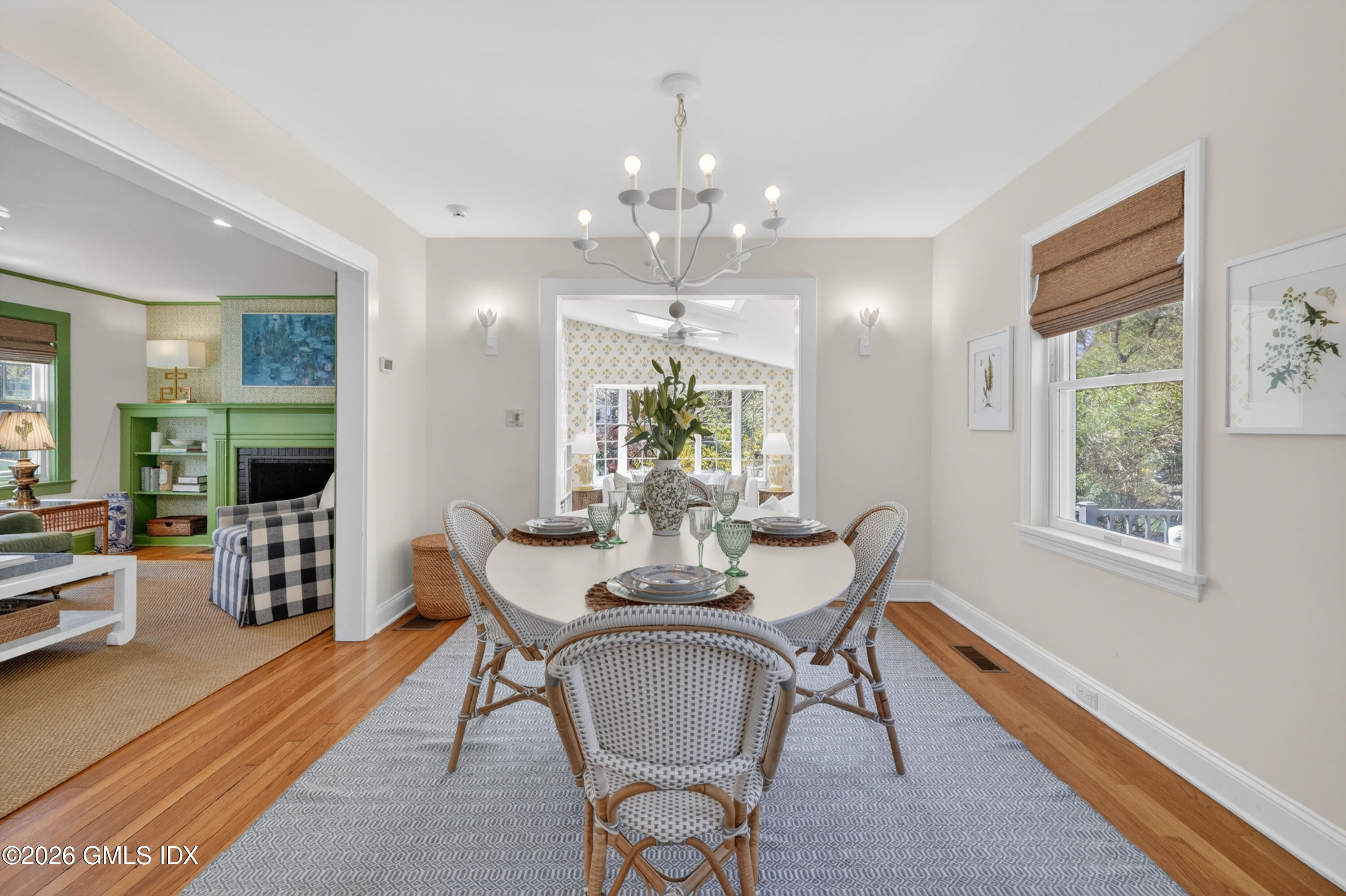 20 Ridge Road Cos Cob, CT 06807 - Photo 10 of 36 a dining room with furniture a chandelier and wooden floor