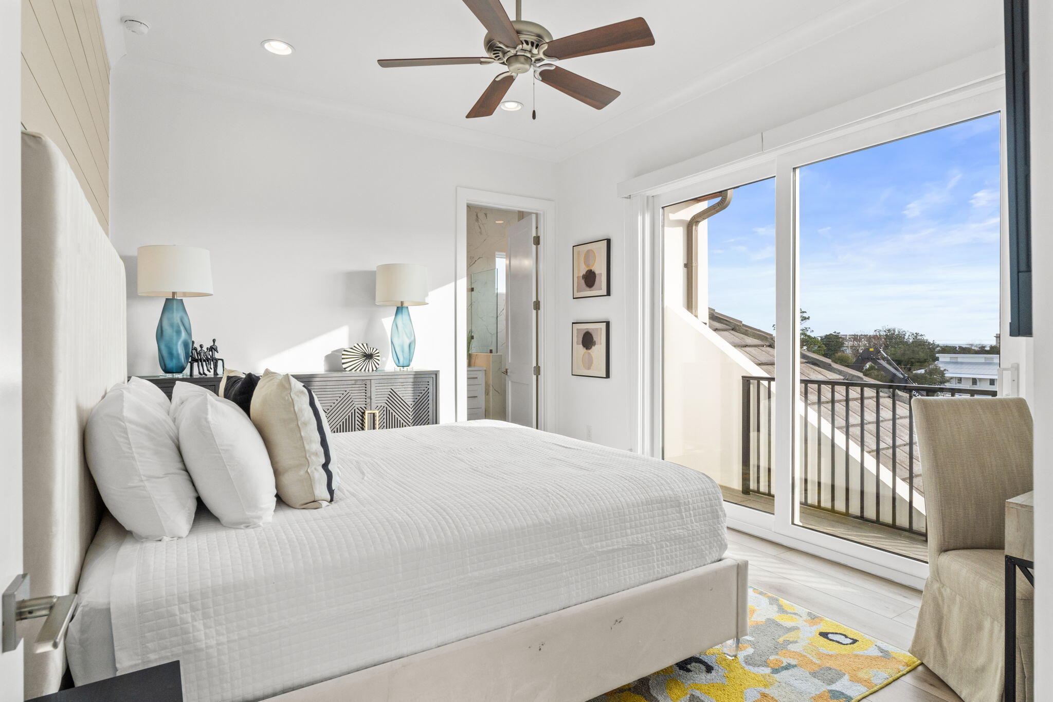 17 Penny Lane Santa Rosa Beach, FL 32459 - Photo 36 of 91 a bedroom with a bed and a chandelier