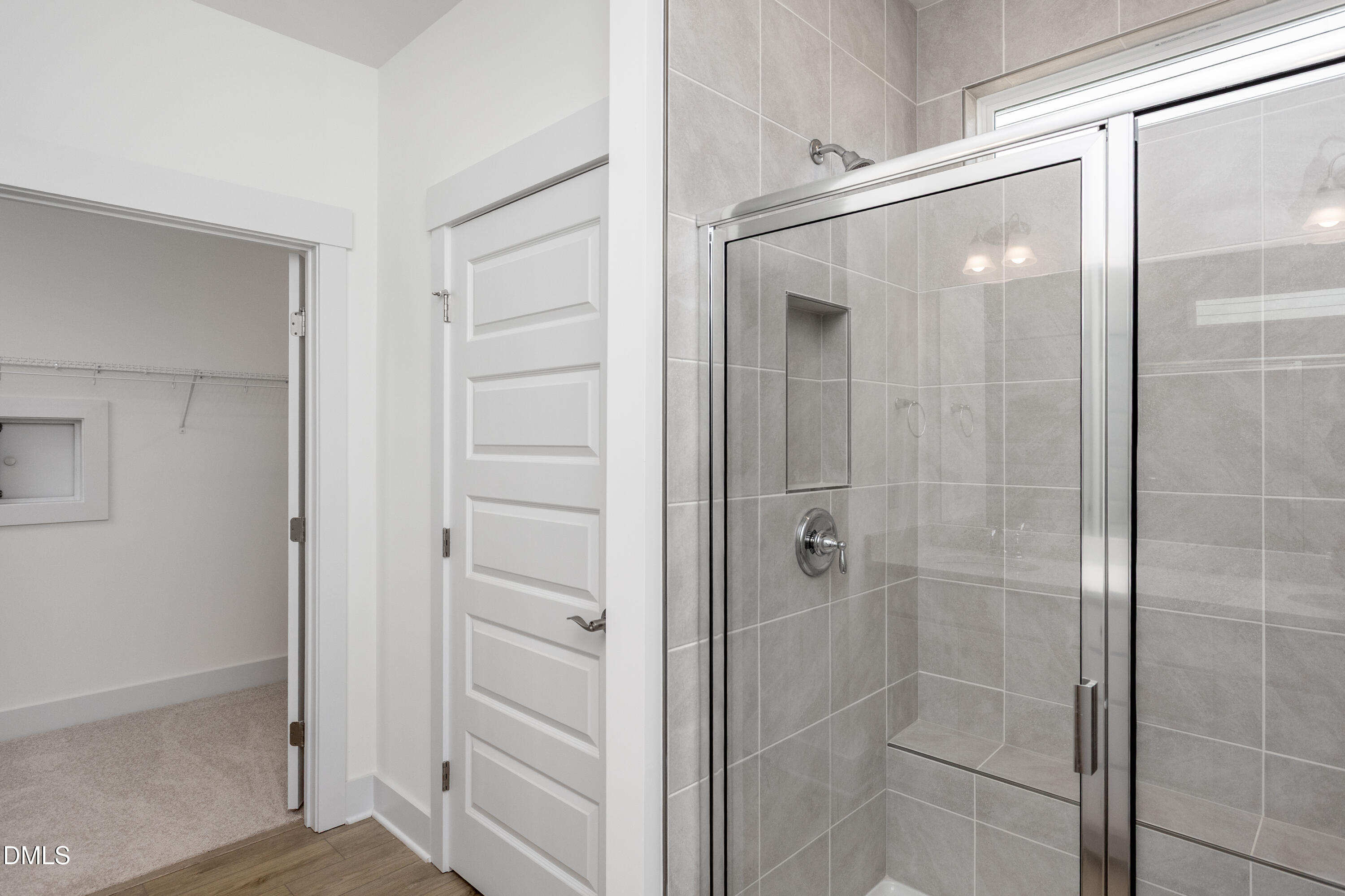 70 Slippery Elm Road Youngsville, NC 27596 - Photo 17 of 32 a bathroom with a glass shower door