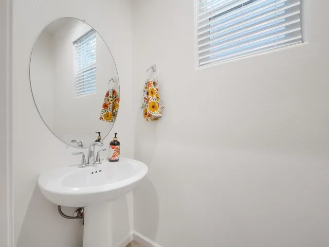 a bathroom with a sink and mirror