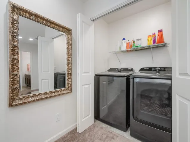 a utility room with washer and dryer