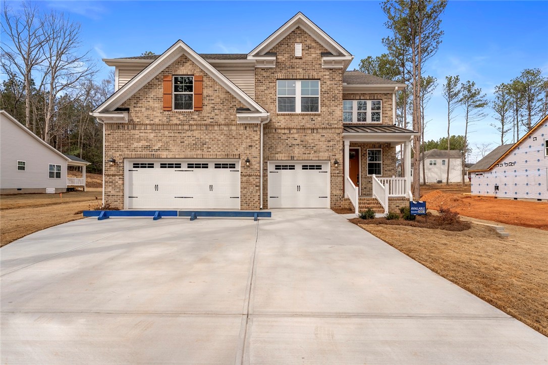 114 Lakeside Drive Anderson, SC 29621 - Photo 1 of 37 This new construction home features a classic brick exterior and a spacious driveway.