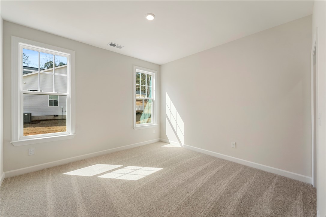 114 Lakeside Drive Anderson, SC 29621 - Photo 14 of 37 Bright and airy, this room provides a blank canvas for personalization.