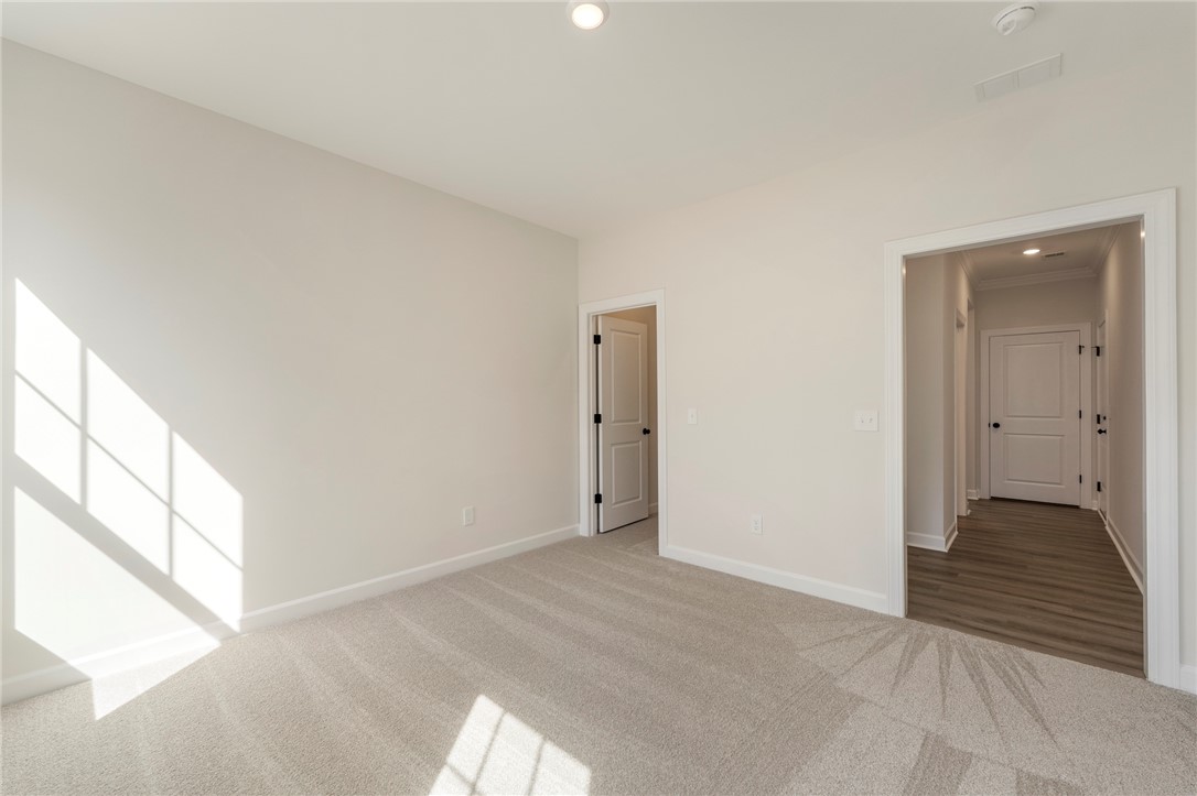 114 Lakeside Drive Anderson, SC 29621 - Photo 15 of 37 This bright bedroom offers a neutral canvas, ready for your personal touch and style.
