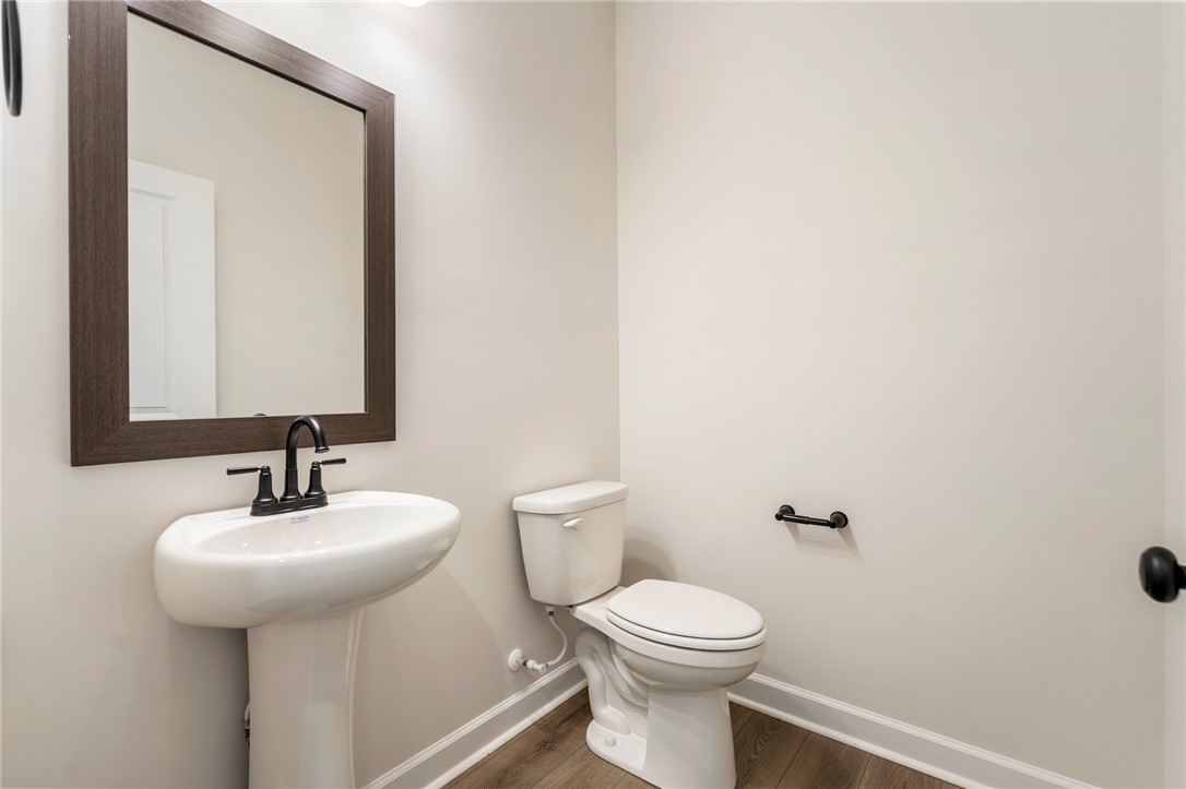 114 Lakeside Drive Anderson, SC 29621 - Photo 16 of 37 This sleek bathroom features a modern pedestal sink and a clean, minimalist design.