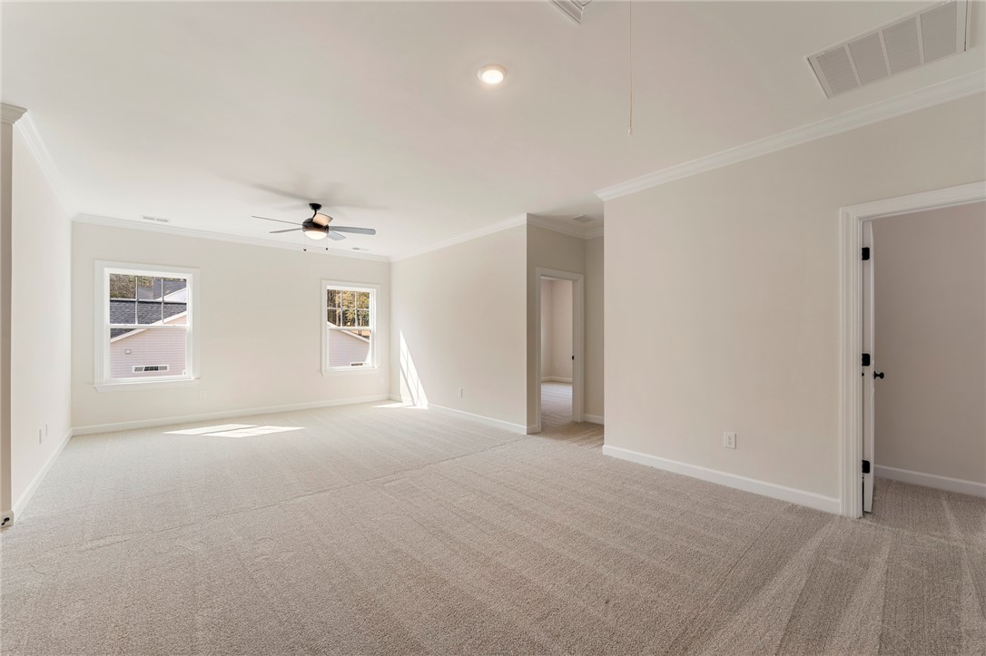 114 Lakeside Drive Anderson, SC 29621 - Photo 24 of 37 This spacious bedroom offers ample natural light and a comfortable, inviting atmosphere.