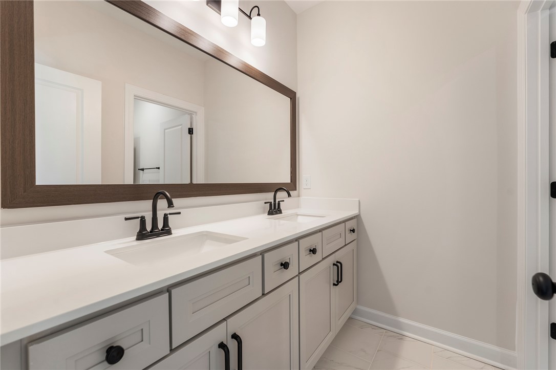 114 Lakeside Drive Anderson, SC 29621 - Photo 30 of 37 This spacious bathroom offers dual vanities, clean lines, and an elegant, contemporary design.