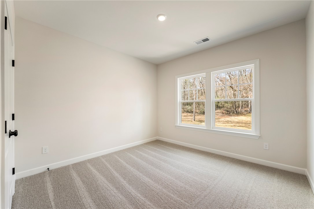 114 Lakeside Drive Anderson, SC 29621 - Photo 33 of 37 This bright and airy room features large windows overlooking natural surroundings.