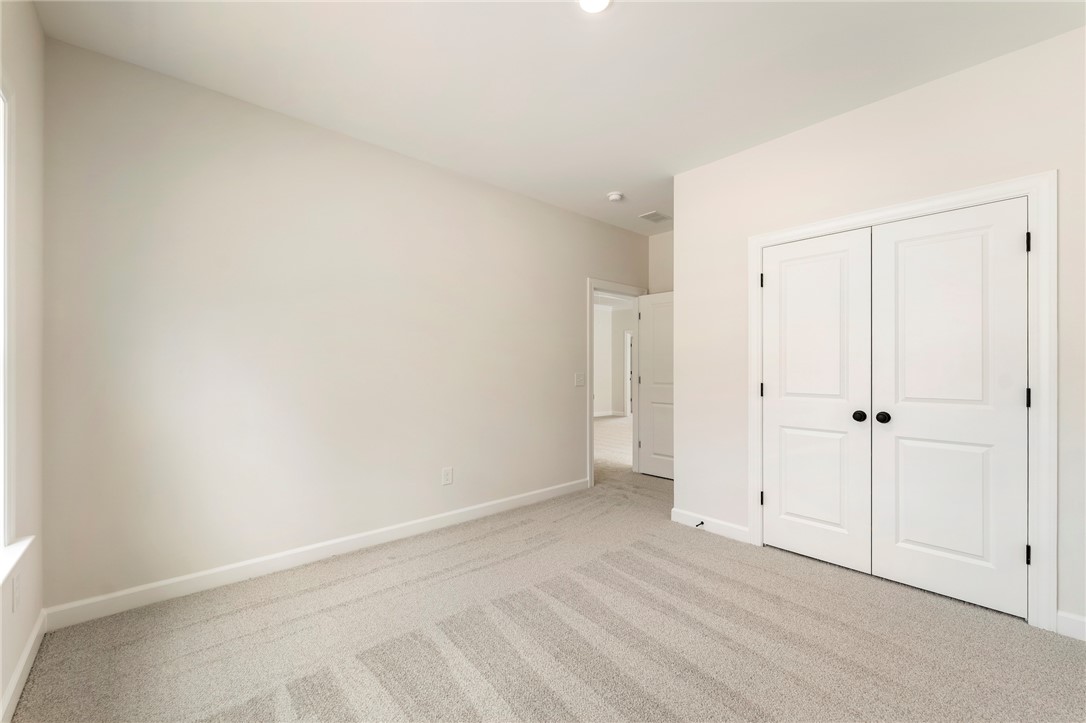 114 Lakeside Drive Anderson, SC 29621 - Photo 34 of 37 This bright and airy room features soft carpeting and ample closet space.