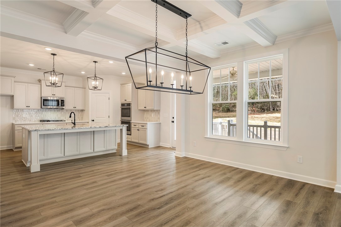 114 Lakeside Drive Anderson, SC 29621 - Photo 8 of 37 An inviting open-concept space features warm flooring and ample natural light.