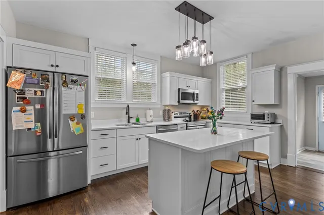 a bathroom with a sink vanity and a mirror