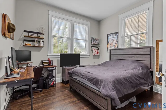 an aerial view of residential houses with outdoor space and swimming pool