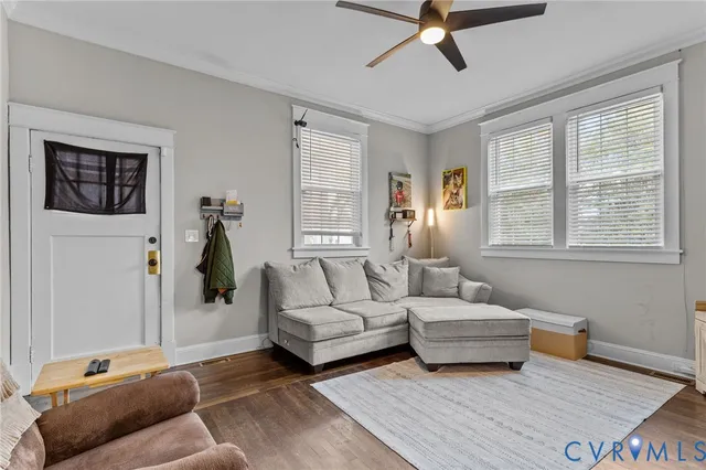 a bedroom with a bed a dresser and a window
