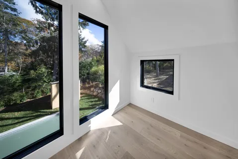 a bathroom with a double vanity sink mirror and shower
