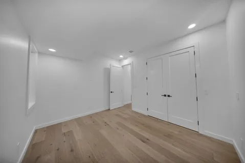 a bathroom with a sink and mirror with toilet