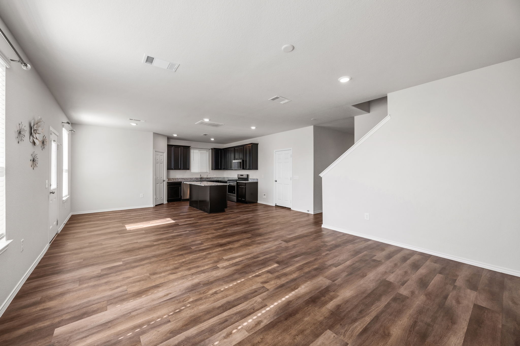 25411 Farmstead Prairie Place Katy, TX 77493 - Photo 11 of 30 a view of kitchen with cabinets and wooden floor