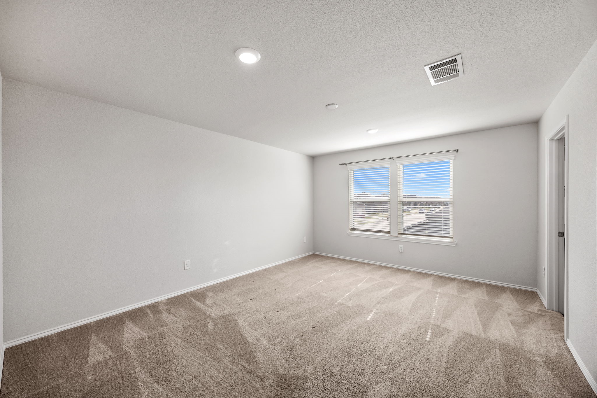 25411 Farmstead Prairie Place Katy, TX 77493 - Photo 17 of 30 a view of an empty room with a window