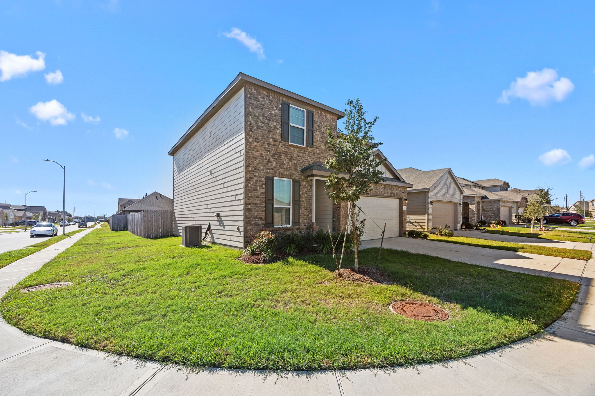 25411 Farmstead Prairie Place Katy, TX 77493 - Photo 4 of 30 a view of a house with a yard and garage