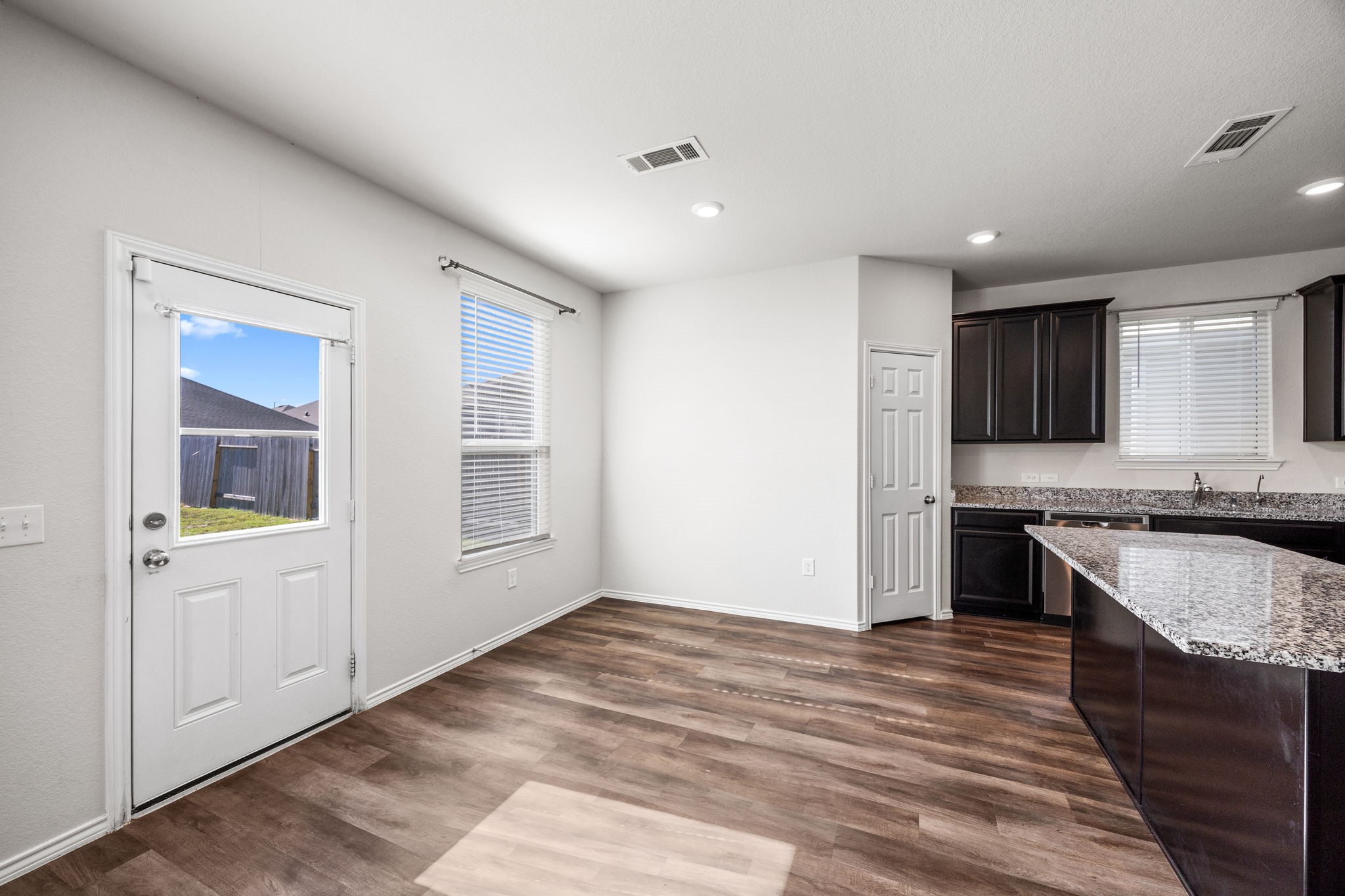 25411 Farmstead Prairie Place Katy, TX 77493 - Photo 10 of 30 a kitchen with stainless steel appliances granite countertop a stove and a sink