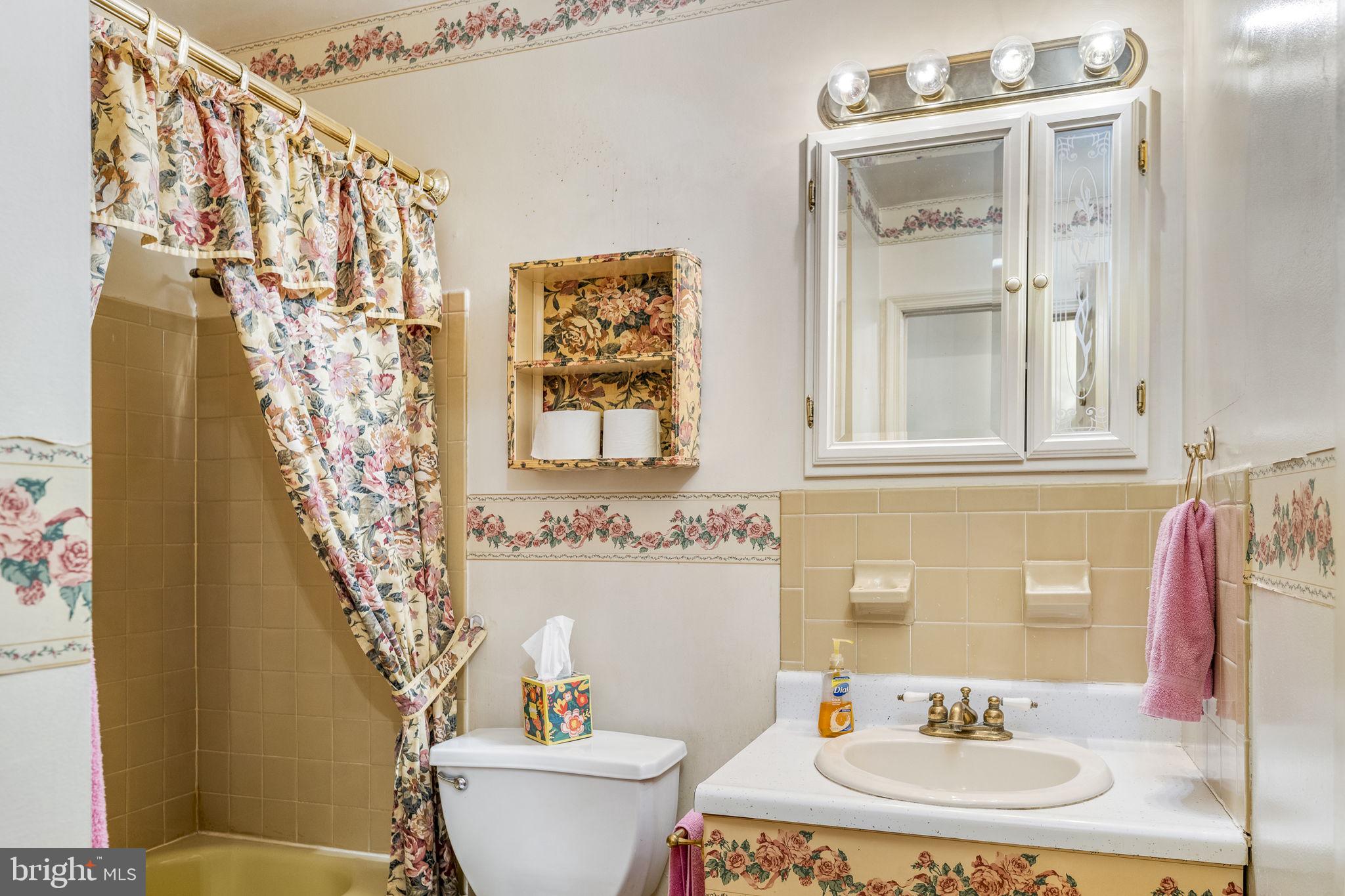 6 Morgan Road Aston, PA 19014 - Photo 12 of 33 a bathroom with a sink a toilet and a mirror