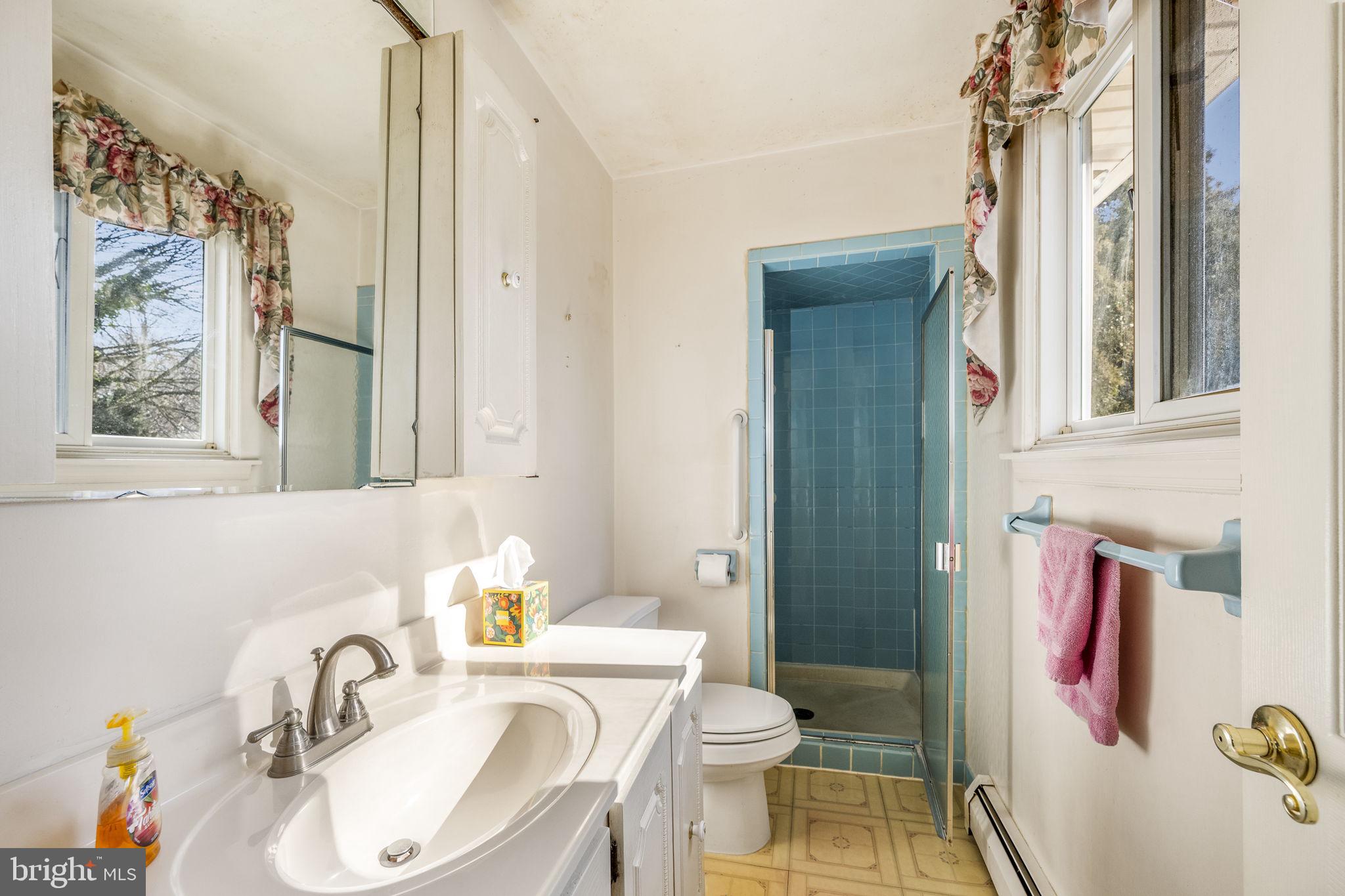 6 Morgan Road Aston, PA 19014 - Photo 15 of 33 a bathroom with a sink toilet and shower