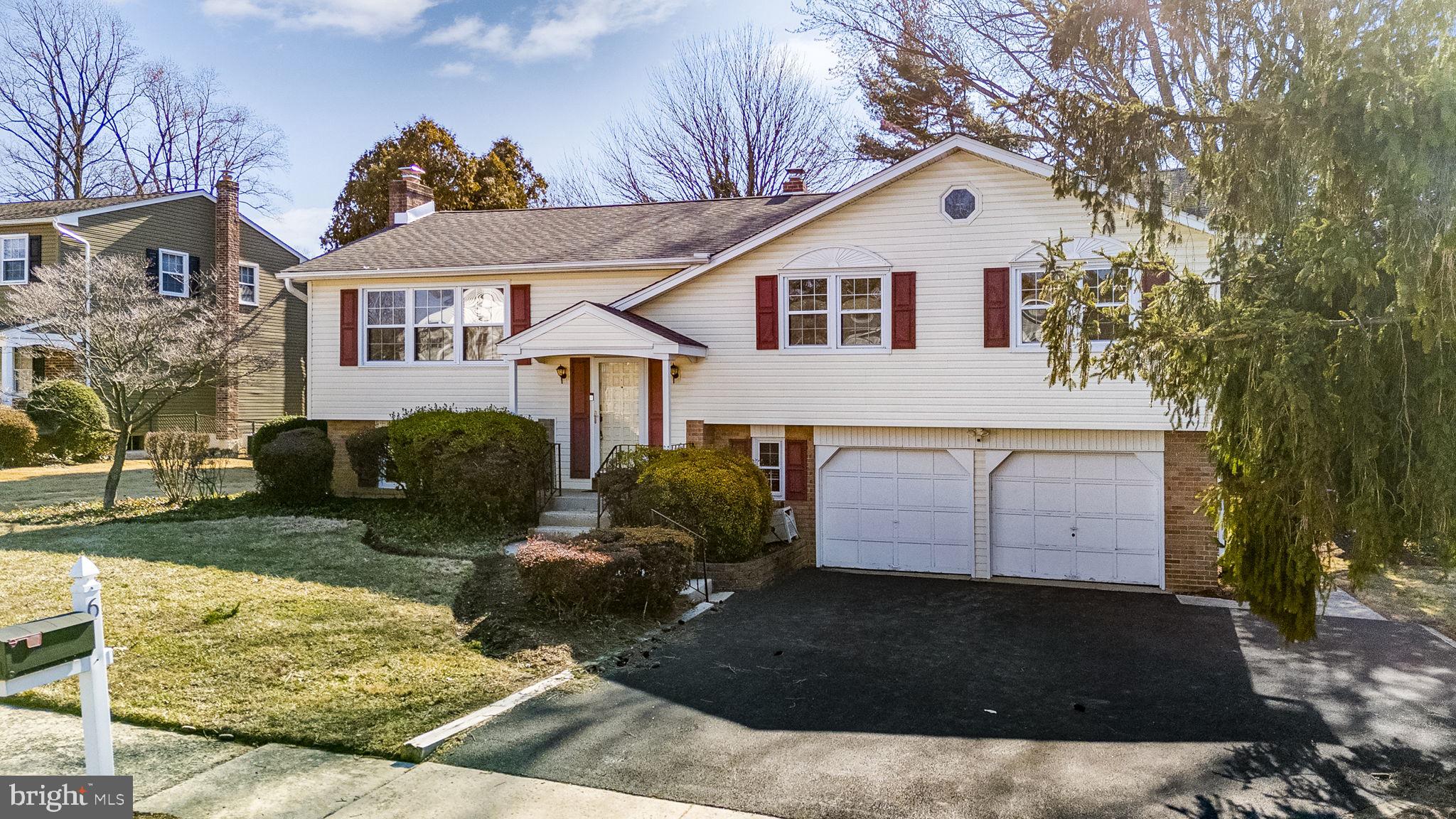 6 Morgan Road Aston, PA 19014 - Photo 3 of 33 a front view of a house with a yard and garage