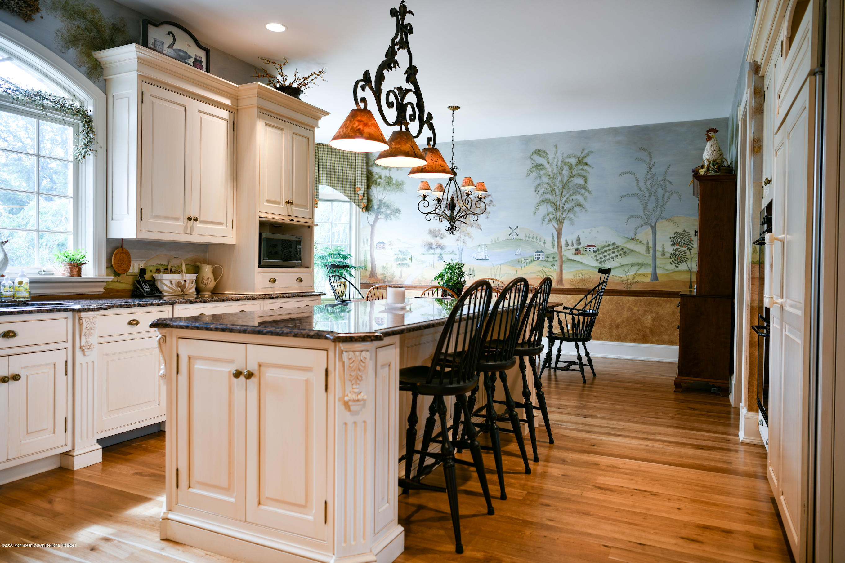 25 Ramsey Road Lebanon, NJ 08833 - Photo 8 of 49 a kitchen with stainless steel appliances granite countertop a stove top oven a sink a dining table and chairs with wooden floor