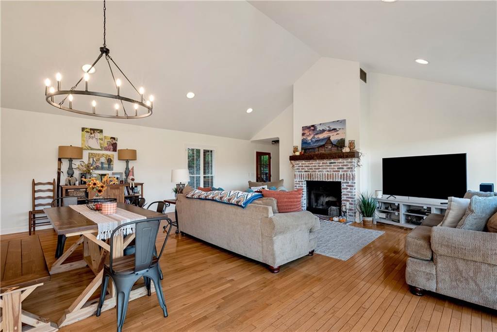 962 Woodbrier Sautee Nacoochee, GA 30571 - Photo 16 of 52 a living room with furniture a fireplace and a flat screen tv