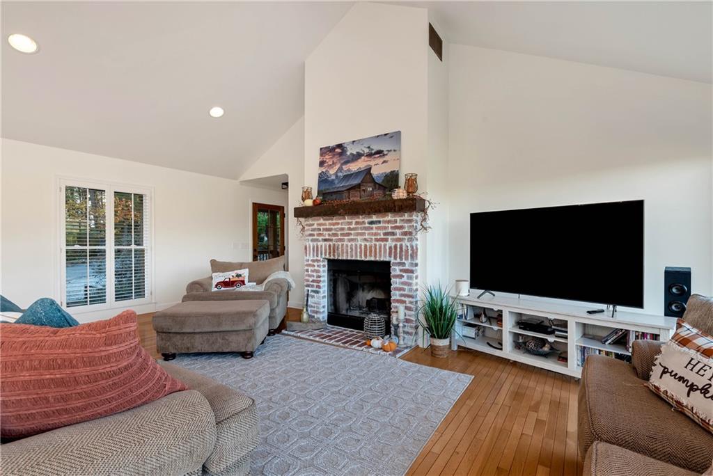 962 Woodbrier Sautee Nacoochee, GA 30571 - Photo 18 of 52 a living room with furniture a flat screen tv and a fireplace