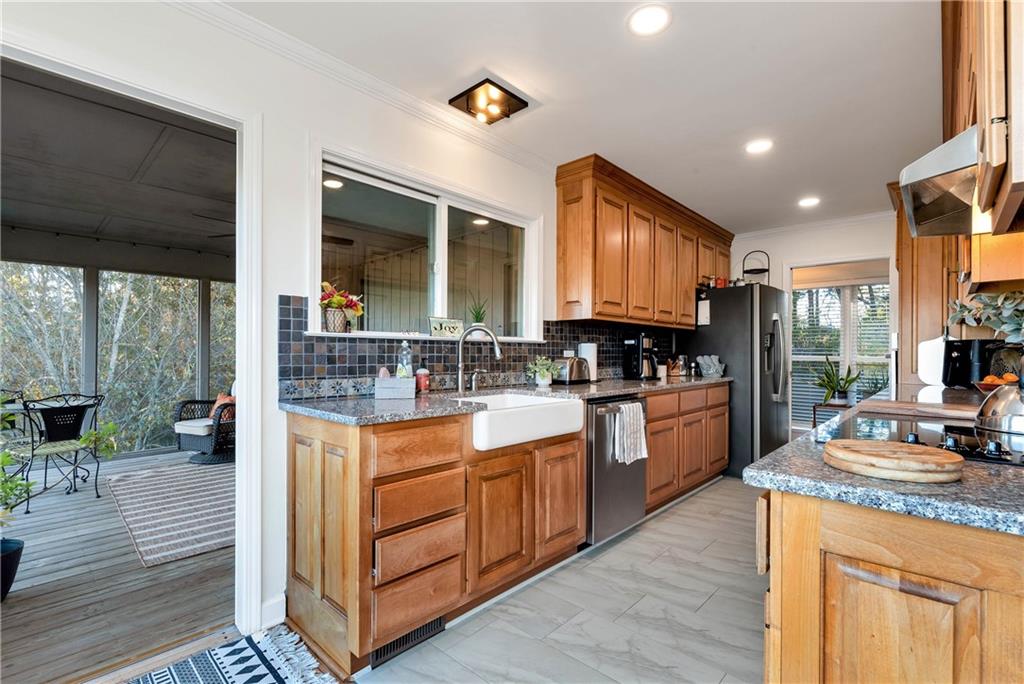 962 Woodbrier Sautee Nacoochee, GA 30571 - Photo 20 of 52 a kitchen with stainless steel appliances granite countertop wooden floors and sink